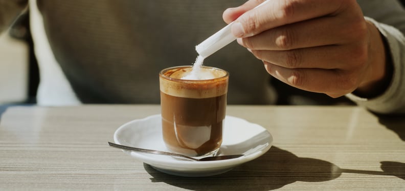 a young man adds artificial sweetener to his machiatto: are artificial sweeteners bad for you?