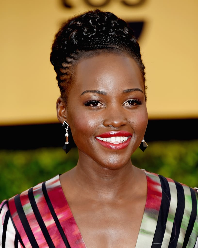 Lupita Nyong'o smartly chose black and silver drop earrings by Fred Leighton to complement her striking graphic-print dress.