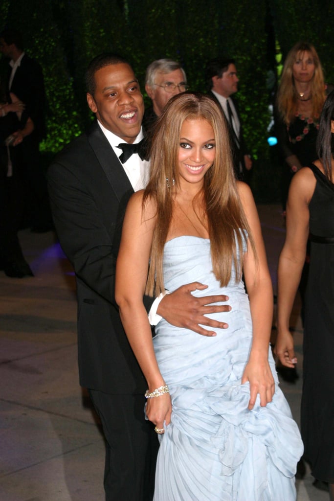 Jay Z held on to Beyoncé as they made their way to the Vanity Fair Oscars afterparty in February 2005.