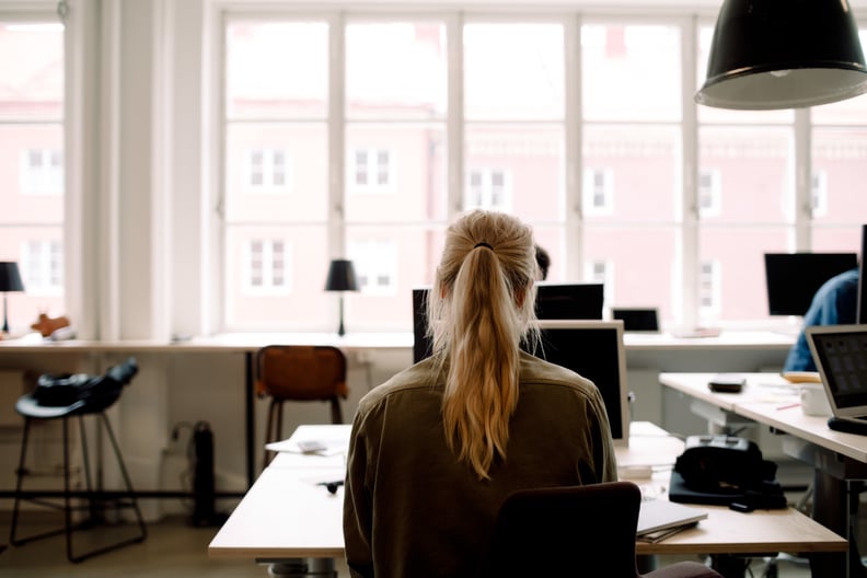 person working at a computer symbolic of capricorn personality traits