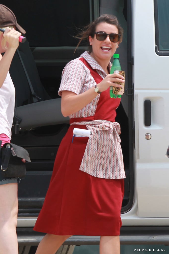 Michele exited her trailer with a beverage.