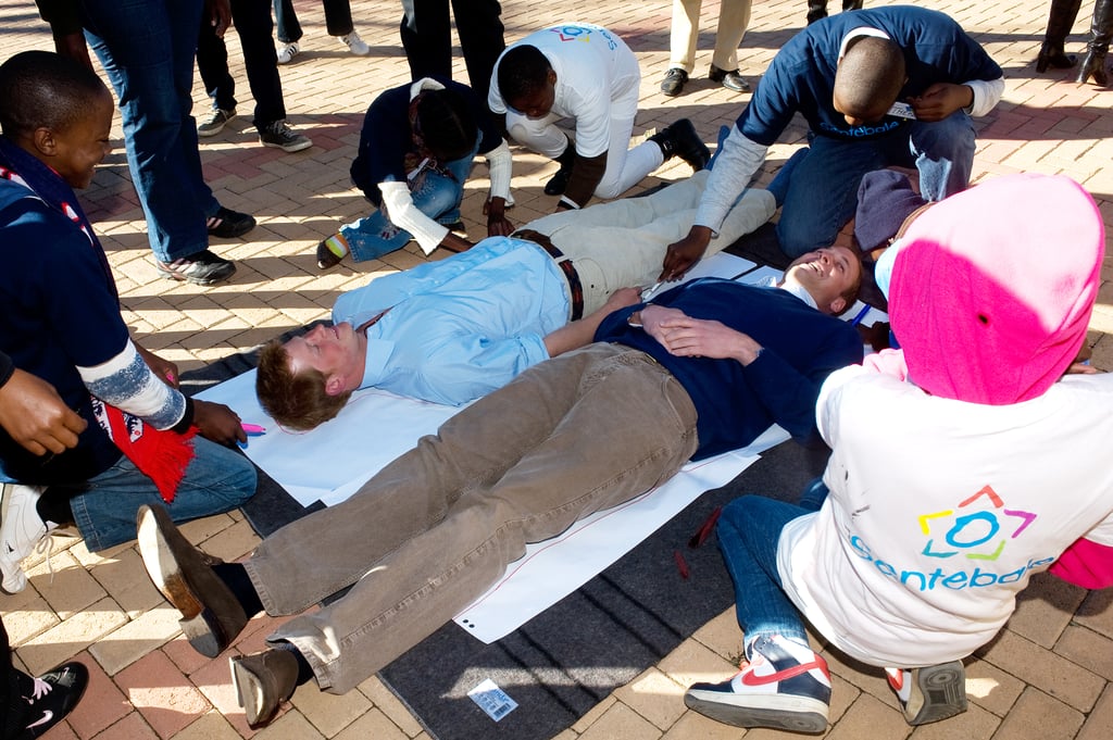 During their June 2010 visit to Lesotho, William and Harry took part in a game in which they had their bodies outlined and then wrote down their future wishes with a group of kids.