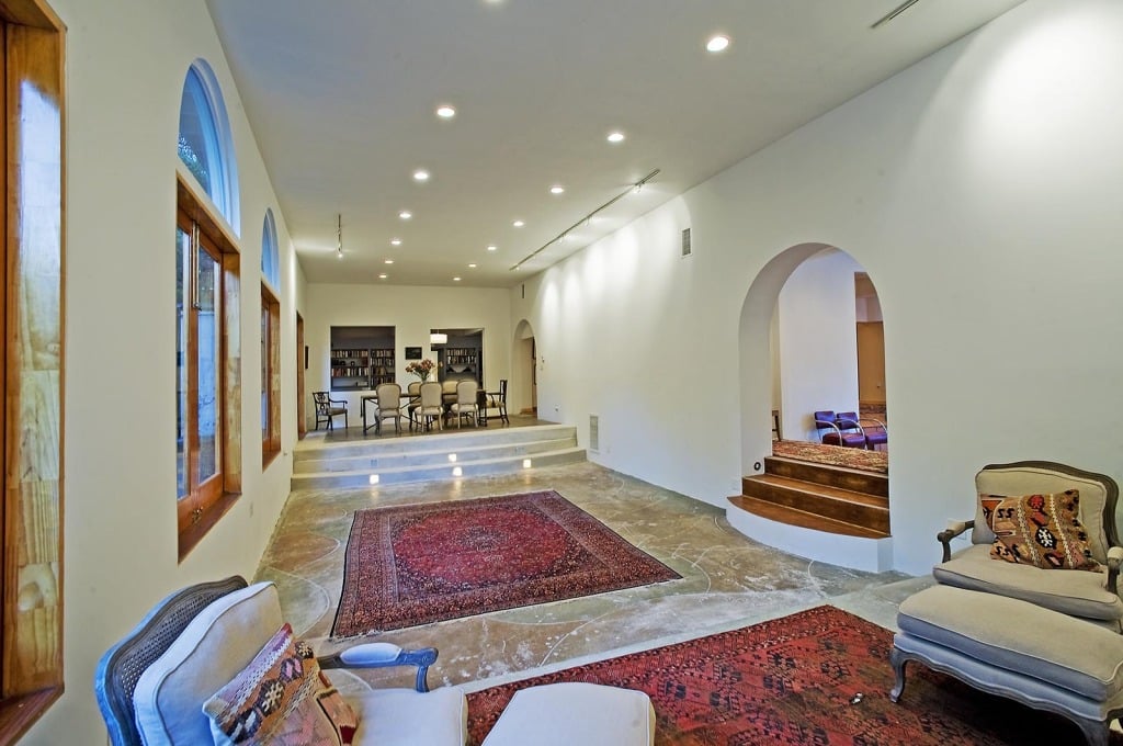 The long stretches of hallway contribute to how large the home feels. 
Source: Everett Fenton Gidley