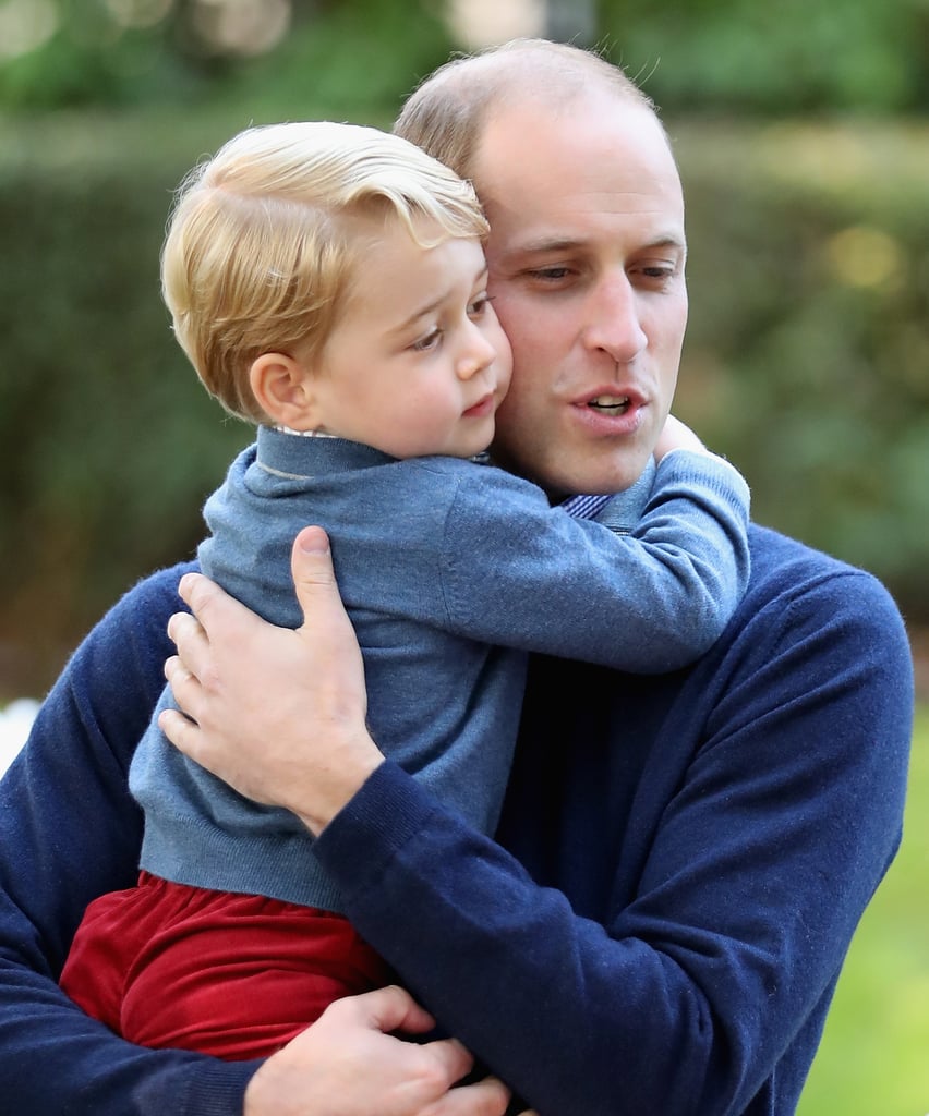 William hugged George tightly during a children's party for military families.