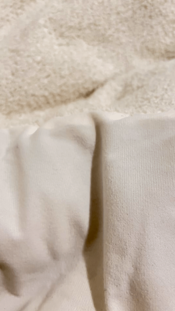 Gif of the Threshold Cozy Chenille Comforter & Sham Set showing the texture of the outer and inner layer of the comforter set.