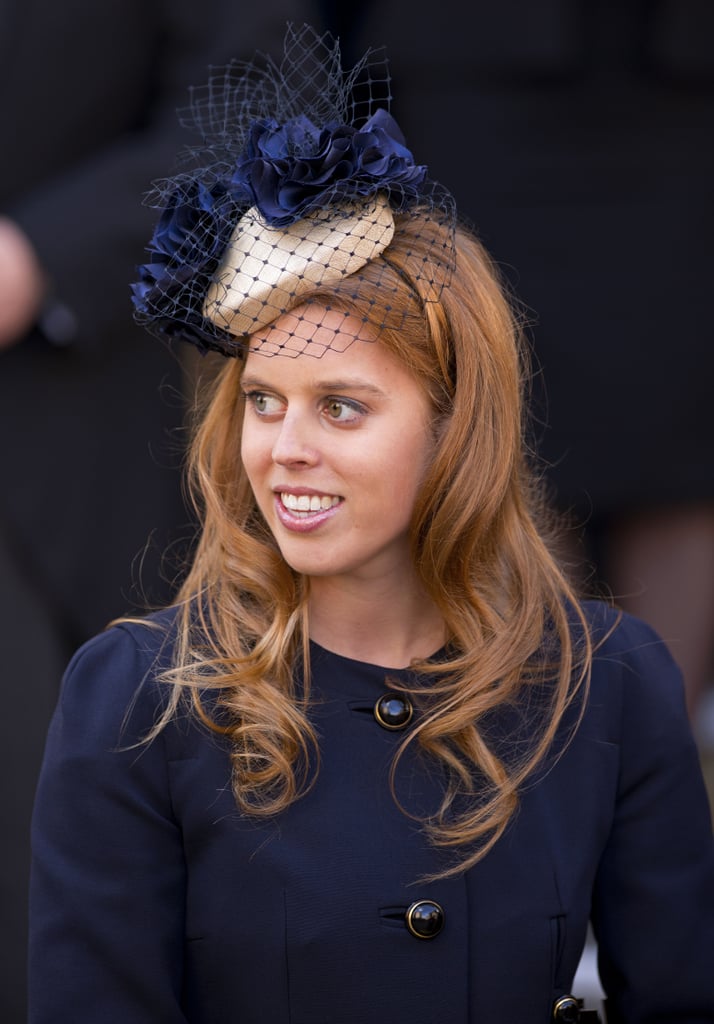 Beatrice in a midnight-blue and cream Gina Foster cocktail hat at a church service in 2012.