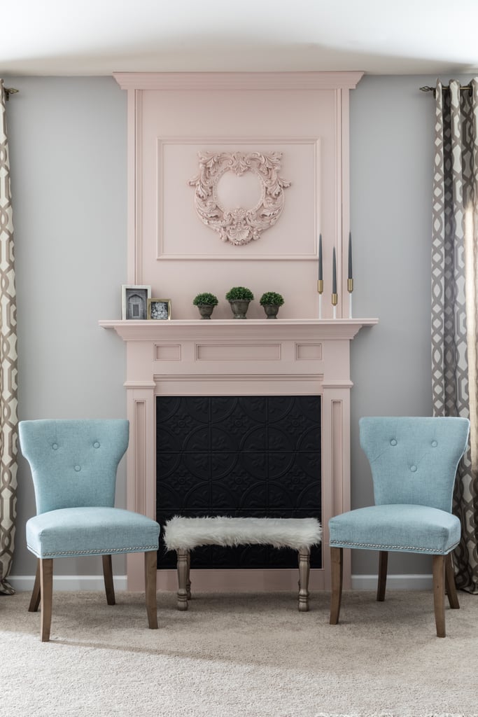 Monica created a stunning focal point from scratch by installing a faux fireplace. She painted it a subtly dramatic pastel pink and lined the back of the fireplace with tin-look tiles ($2 per square foot).