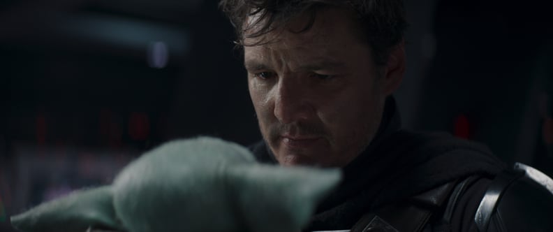 Grogu and the Mandalorian (Pedro Pascal) in Lucasfilm's THE MANDALORIAN, season two, exclusively on Disney+. © 2020 Lucasfilm Ltd. & ™. All Rights Reserved.