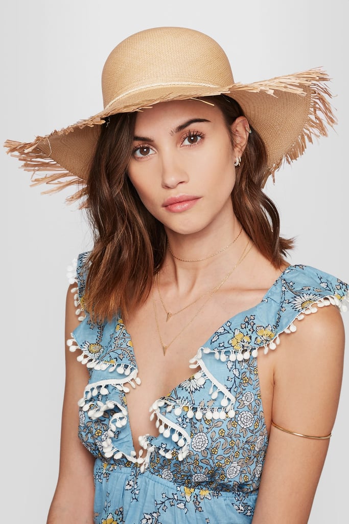 A wear-on-every vacation straw hat, like the Sensi Studio — Lady Majorca Frayed Toquilla Straw Hat — Sand ($150).