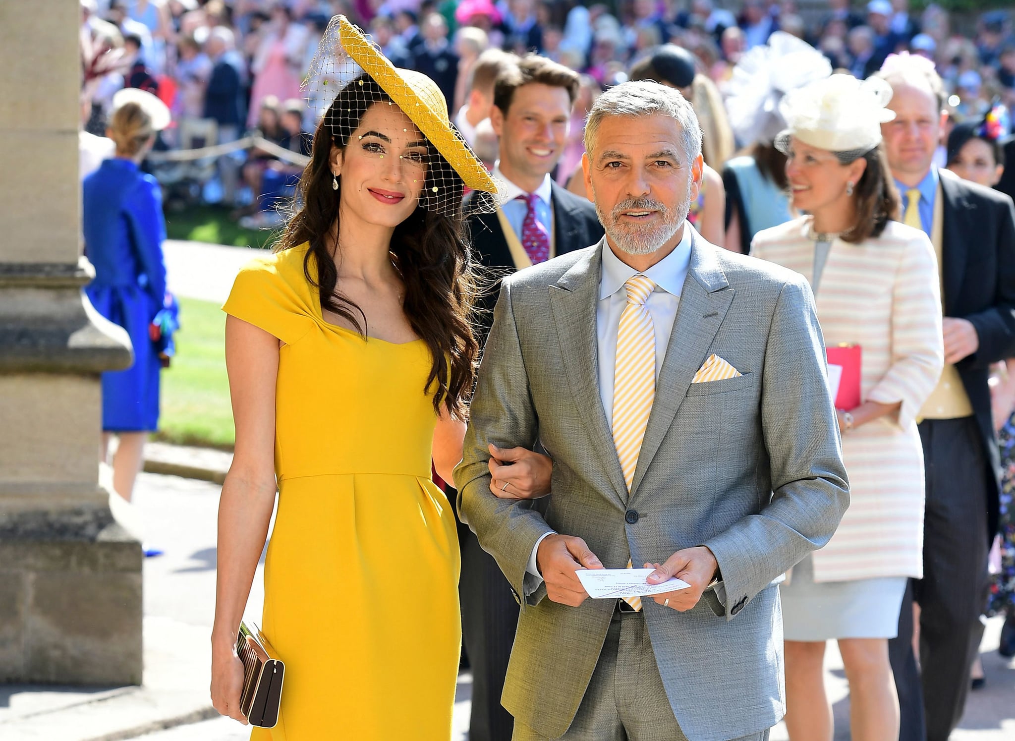 US actor George Clooney (R) and his wife British lawyer Amal Clooney (L) arrive for the wedding ceremony of Britain's Prince Harry, Duke of Sussex and US actress Meghan Markle at St George's Chapel, Windsor Castle, in Windsor, on May 19, 2018. (Photo by Ian West / POOL / AFP)        (Photo credit should read IAN WEST/AFP/Getty Images)