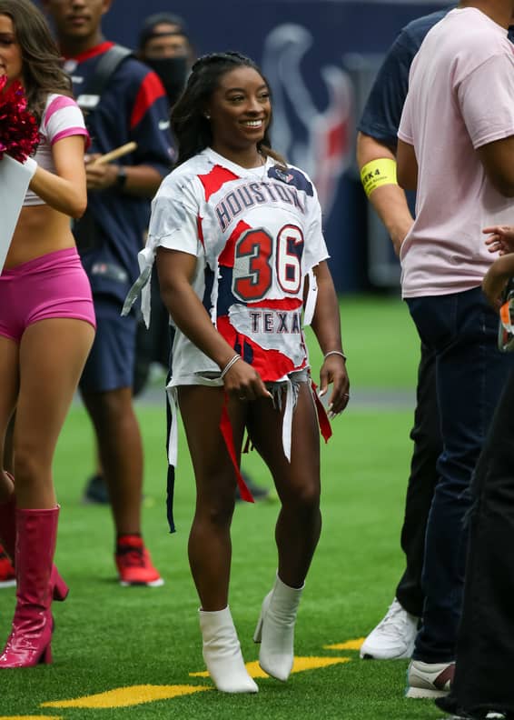 Simone Biles Wears a Red Owens Sweatshirt For Jonathan Owens