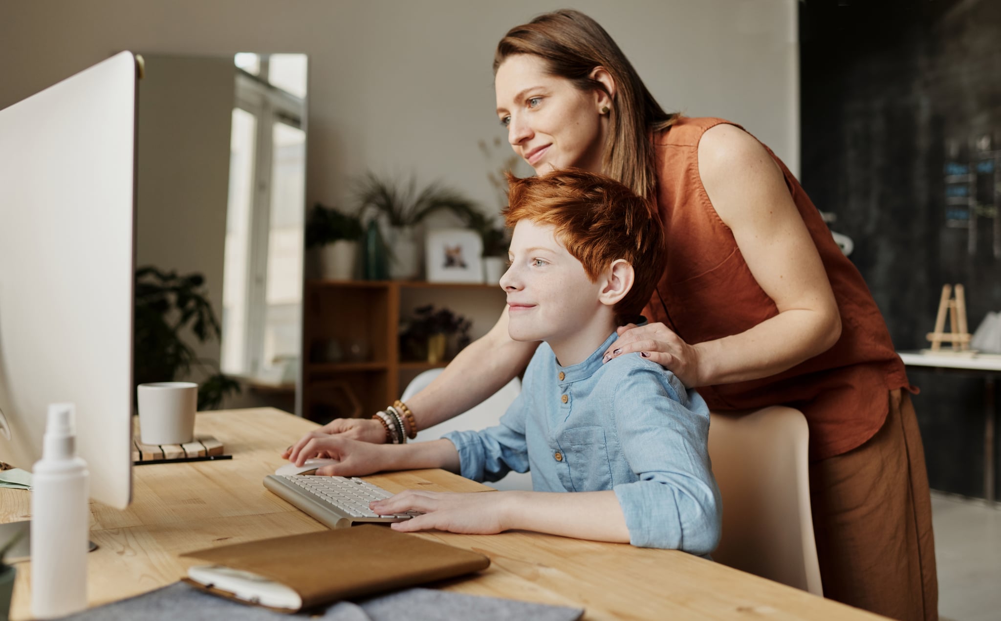 tmp_yZEYNX_0167bce616143a25_photo-of-woman-teaching-his-son-while-smiling-4145355.jpg