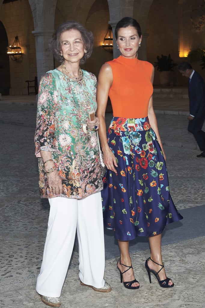Queen Sofía in a Printed Tunic and White Trousers, August 2018