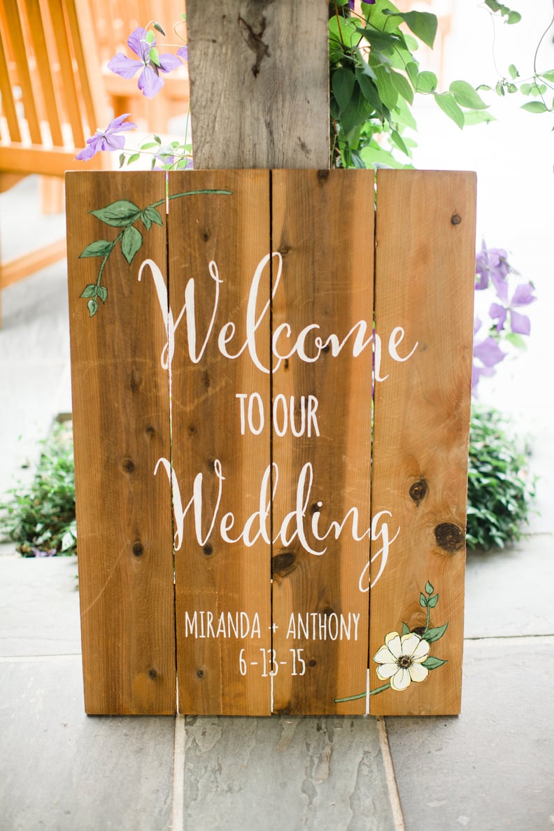Welcome guests with a calligraphic wooden sign.