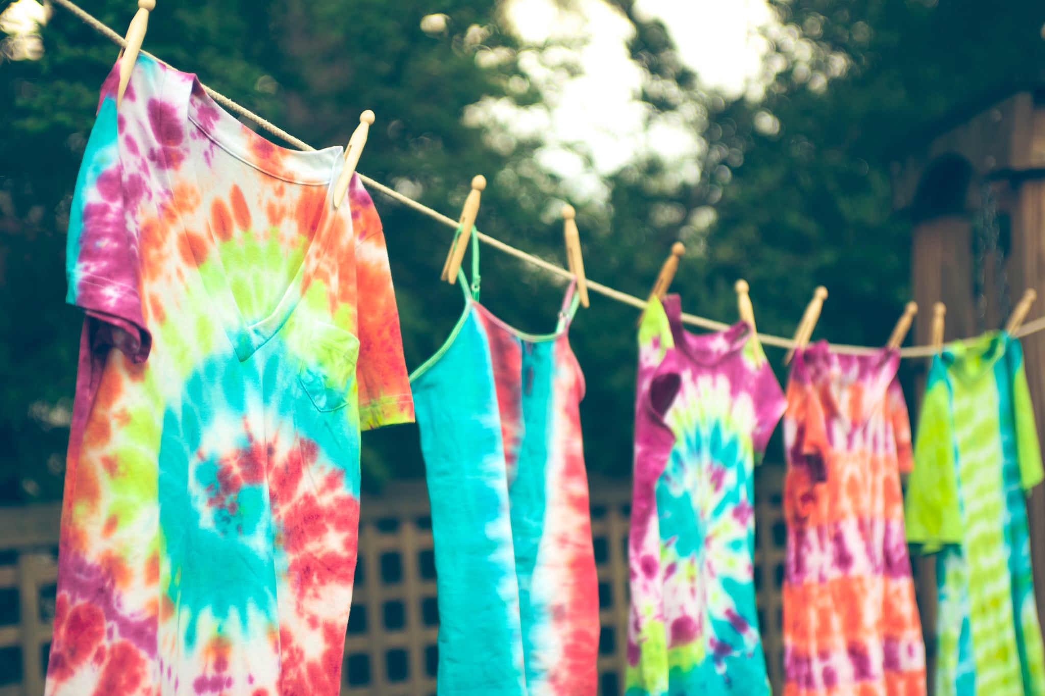 Groovy tie dyed tee shirts hanging from a clothes line