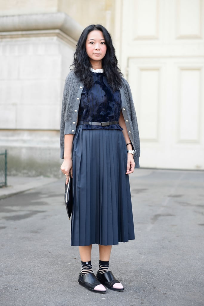 If you chose to wear an all-navy outfit, style it with a pair of black loafers or booties. Jannet Liu pulled this off perfectly and with striped socks too.