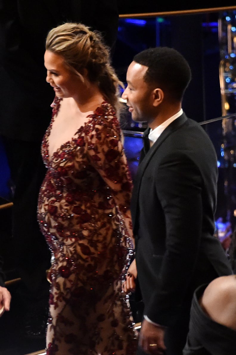 Chrissy Teigen and John Legend held hands as they walked through the audience.