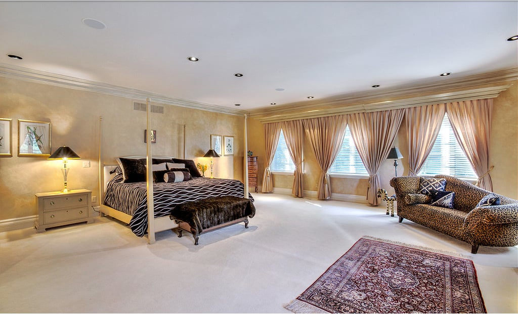 The palatial master bedroom (aka your room) connects to its own sitting area, dressing room, and massive bathroom. The other four bedrooms are in a separate wing of the home.