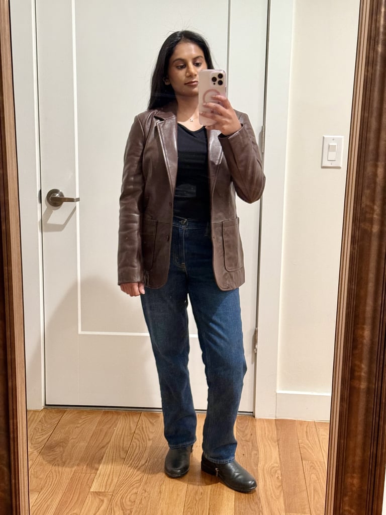 Quince 100% Leather Blazer ($250)
Height: 5'1"
Size: Small (usual size)
"As someone who has been collecting genuine leather jackets for years, I have high standards for quality and fit. Quince's leather blazer has become one of my favorite pieces to style for all seasons. The leather is soft and malleable but also durable. I can tell that this piece will only get better the more I wear it, forming a beautiful, unique patina. Most leather blazers on the market have an oversize fit, which can look overwhelming on me since I'm 5'1". This one fits more true to size with a timeless silhouette that instantly elevates any outfit. It doesn't look too boxy on me, but it's roomy enough to accommodate sweaters without feeling stuffy. Plus, the leather jacket is as functional as it is stylish. It keeps me warm during the brisk NYC evenings, though I don't recommend wearing it in snowy, true winter weather." — Anvita Reddy, former assistant shopping editor
Rating: