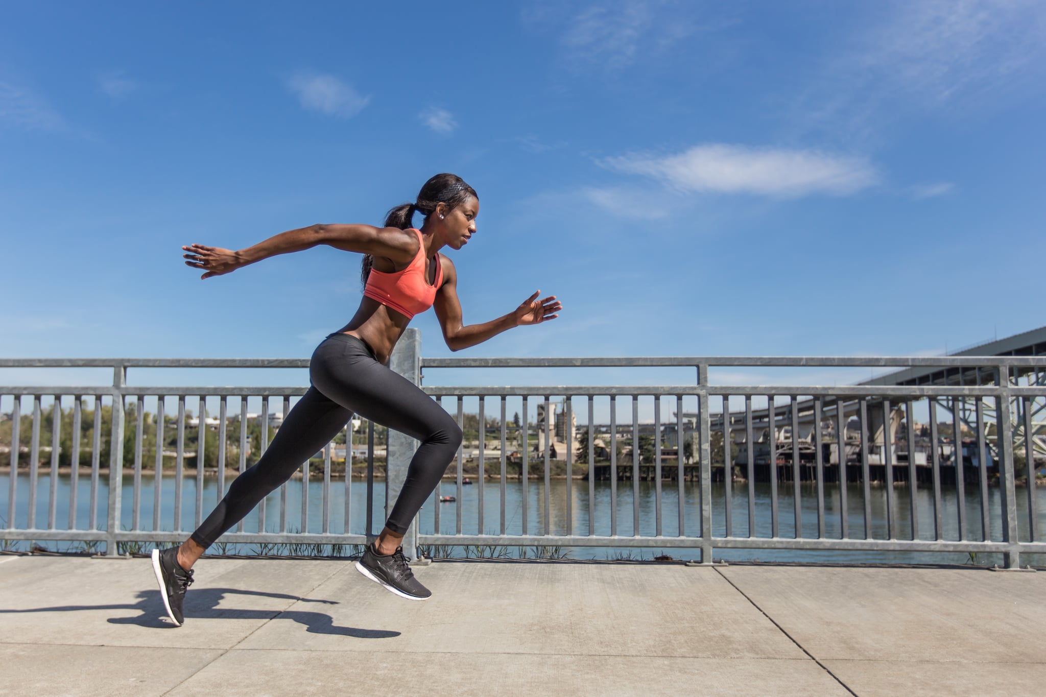 Attractive female sprinter training in the city