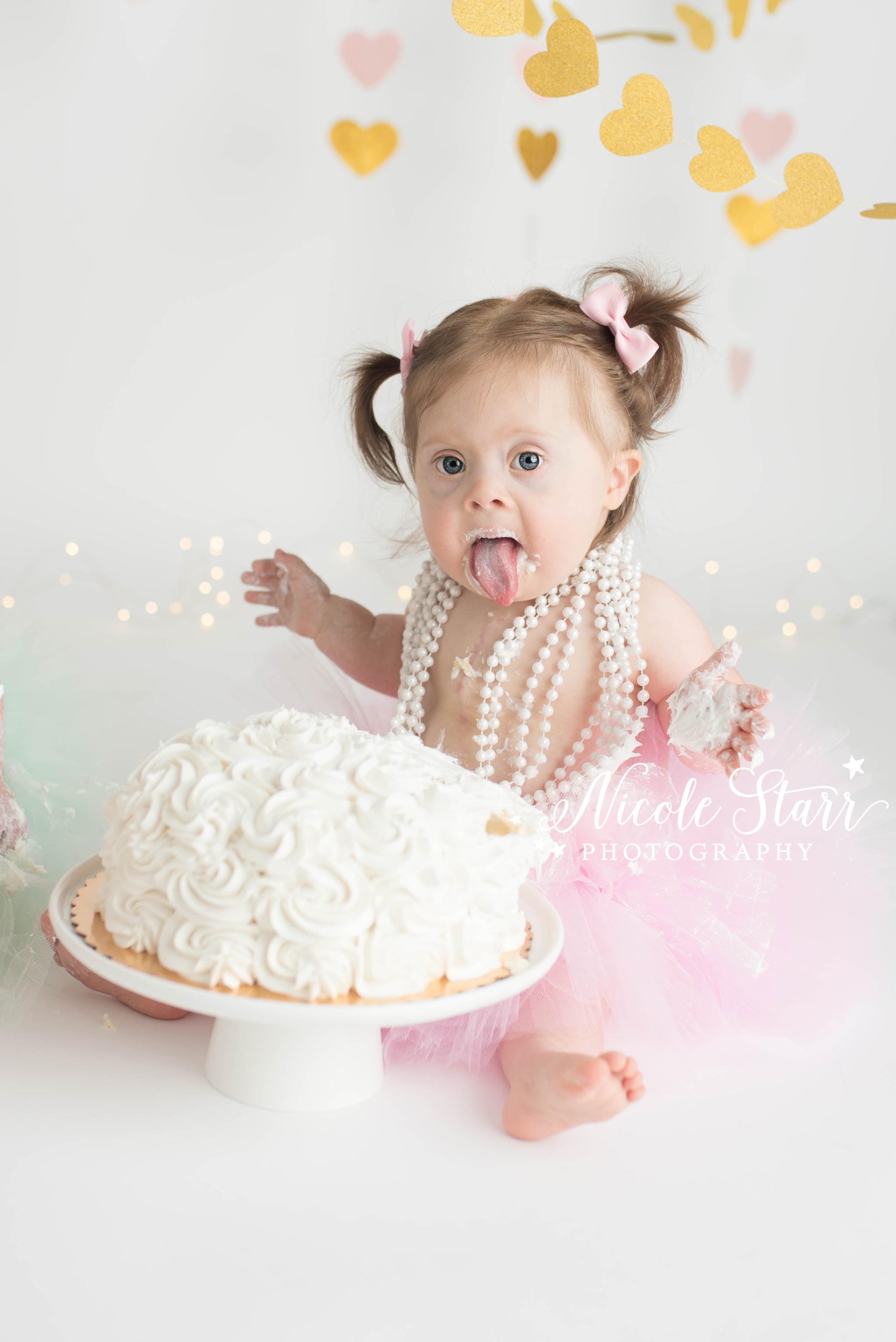 Three Of Hearts Girls With Down Syndrome Cake Smash Popsugar Family