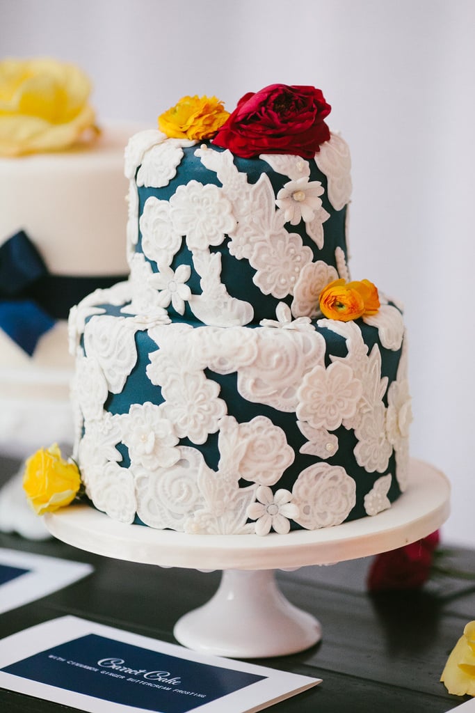 Don't the floral embellishments of this darling cake remind you of doilies? Not your grandma's doilies, though — set against a deep blue base, these are ultrachic. 
Photo by Pen/Carlson via Style Me Pretty