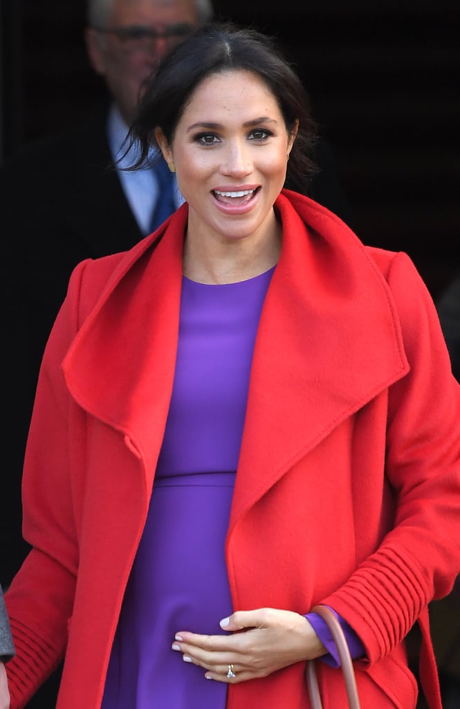 Meghan Markle Touching Baby Bump Pictures