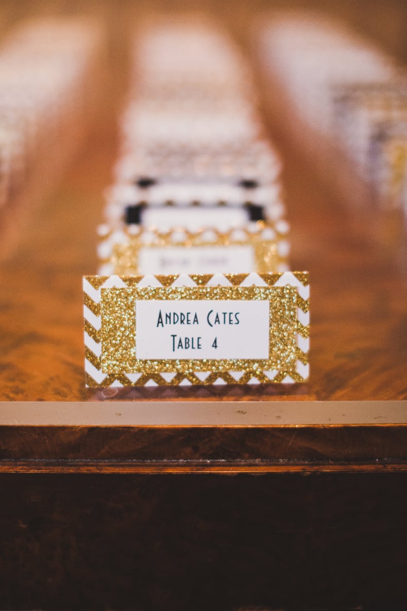 Organize place cards by table with different glittery colors.