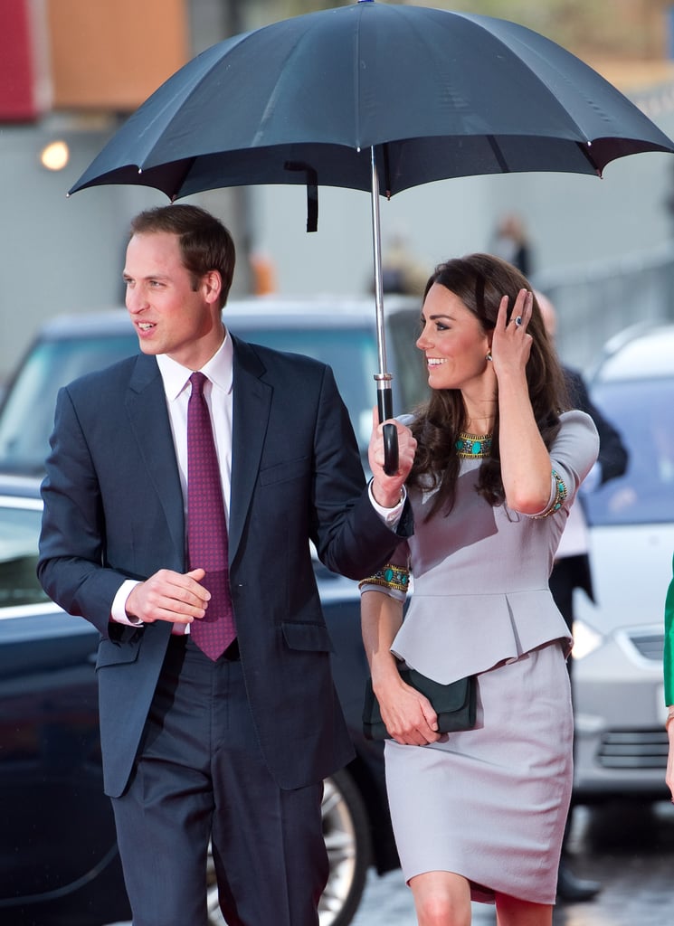 Prince William held an umbrella for Kate Middleton on their way into the April 2012 premiere of African Cats in London.