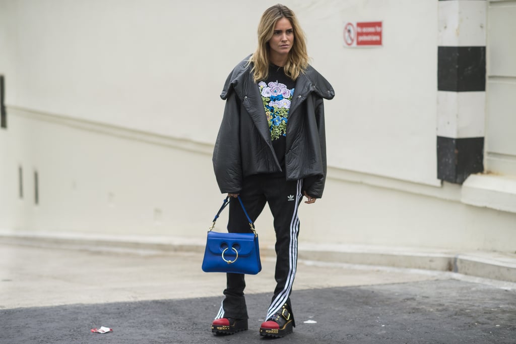 With Edgy Moto Boots, a Floral Sweatshirt, and Your Favorite Fancy Bag