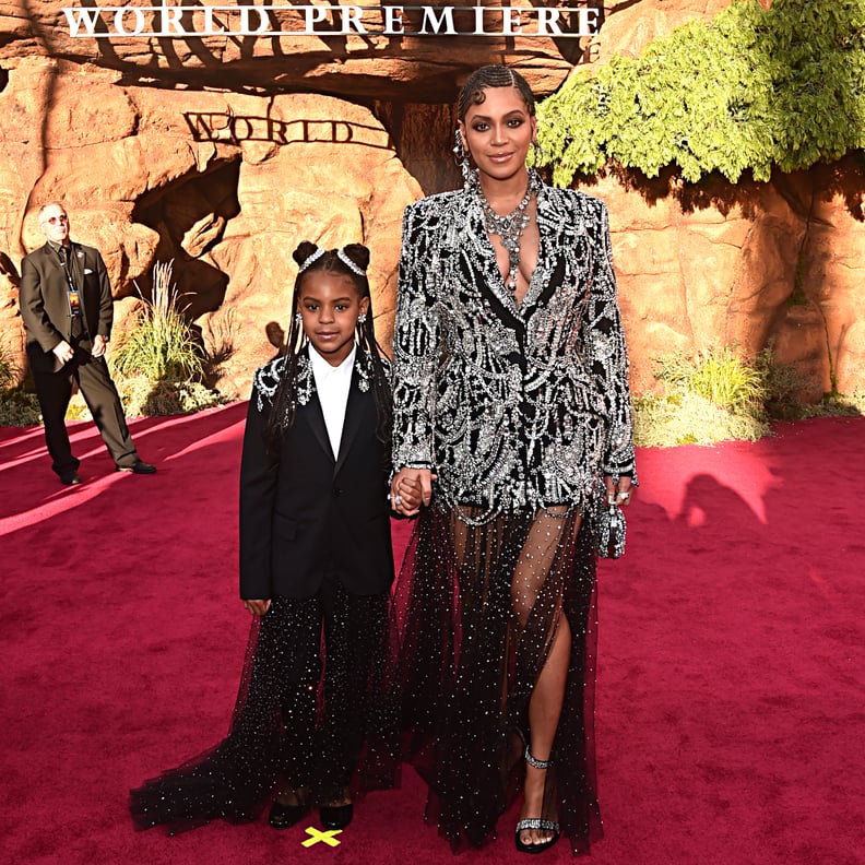 HOLLYWOOD, CALIFORNIA - JULY 09: (EDITORS NOTE: Retransmission with alternate crop.) Blue Ivy Carter (L) and Beyonce Knowles-Carter attend the World Premiere of Disney's 