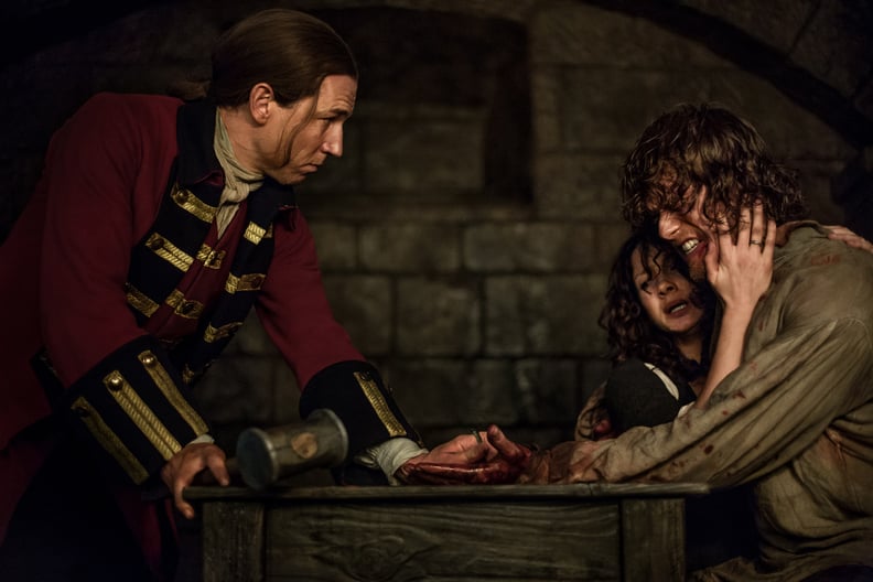 Jamie and Claire protect each other from the brunt of Black Jack's wrath