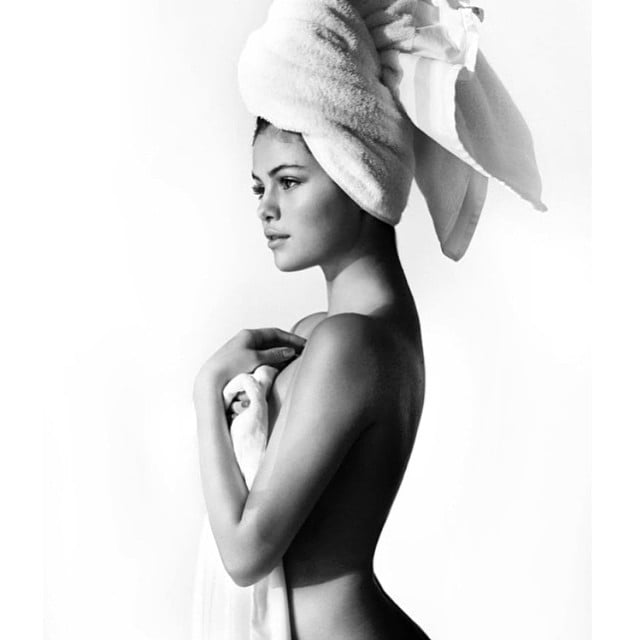 She posed for Mario Testino as part of his revealing towel series.
