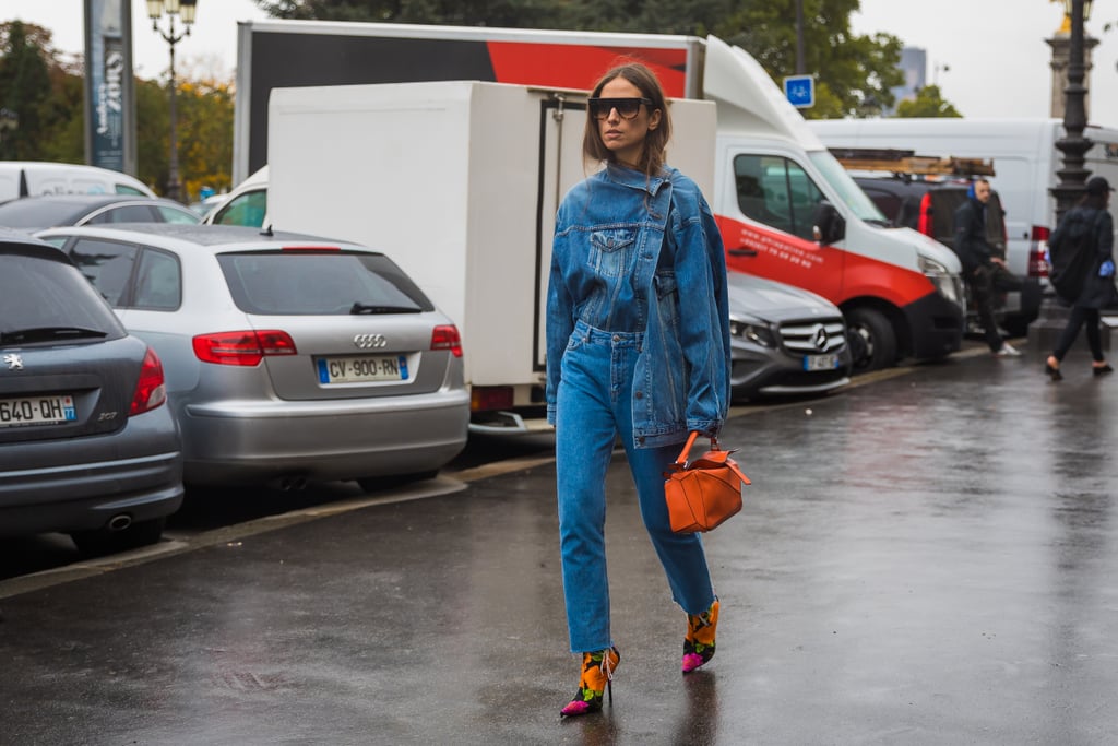 Haven't you heard? Everyone's rocking the denim on denim trend with a deconstructed twist. This street style star brought a pop of color to her look with Balenciaga floral sock booties.