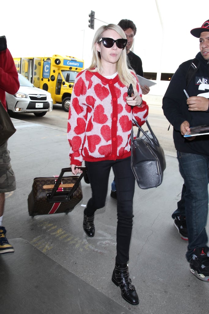 Sometimes all it takes is one piece to take your travel look to the next level. In Emma Roberts's case, it was a heart-printed sweater.