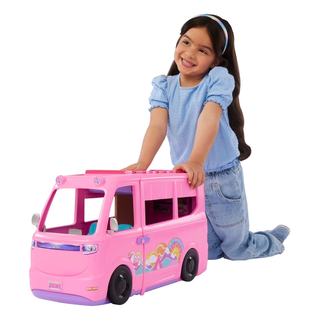 Barbie Dream Camper Playset  ($89, originally $108)
Barbie's taking glamping to a whole new level with the brand-new Barbie DreamCamper. The pink RV unfolds into an outdoor paradise complete with a pop-up roof tent, swing chair, fishing pond, and a puppy sidekick. It even comes with three tubs of dough and a barbecue mold so kids can "grill" up burgers that actually change color with warm and icy water before Barbie and friends kick back under the stars. Goals.