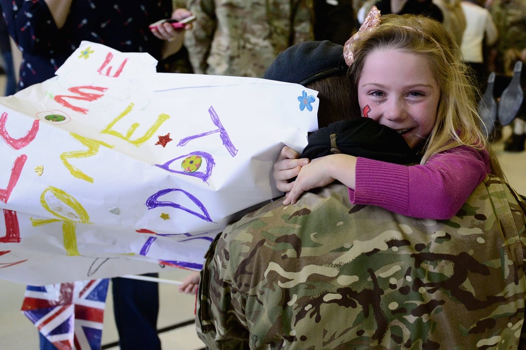 Seven-year-old Jessica hugged her dad, Flight Lt. Andy Power, when they were reunited.