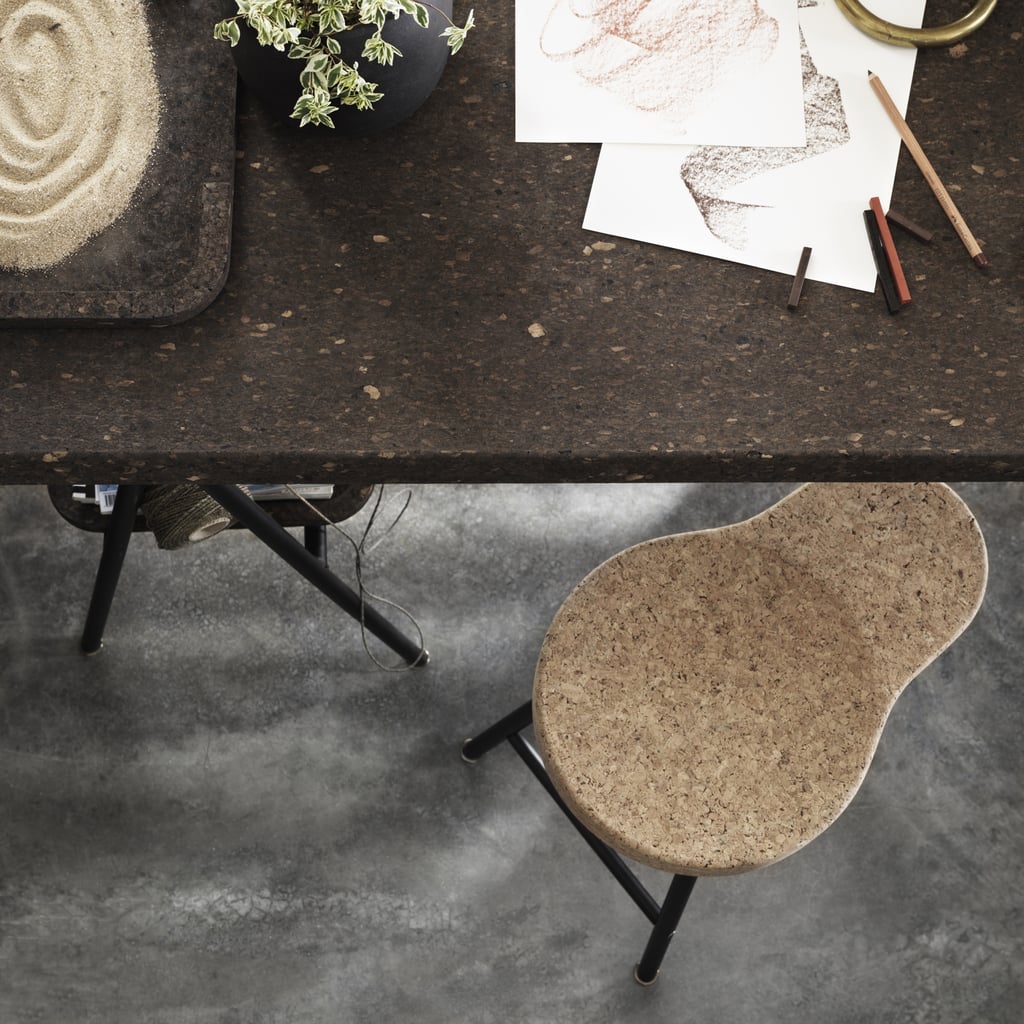Cork is used on many surfaces in the collection. A thin layer covers the top of this dining table ($349) and stool ($59).