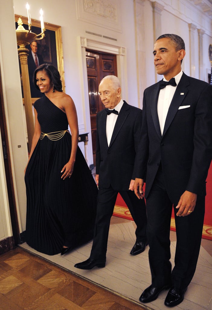 Wearing a Michael Kors dress and House of Lavande vintage earrings at a dinner to honor Israeli President Shimon Peres in 2012.