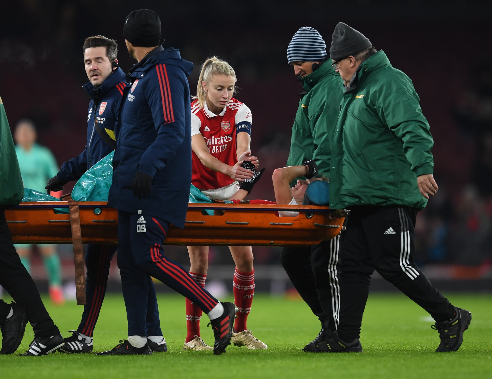 LONDON, ENGLAND - DECEMBER 15: Leah Williamson of Arsenal checks on her injured team mate Vivianne Miedemsa during the UEFA Women's Champions League group C match between Arsenal  and Olympique Lyon at Emirates Stadium on December 15, 2022 in London, England. (Photo by David Price/Arsenal FC via Getty Images)