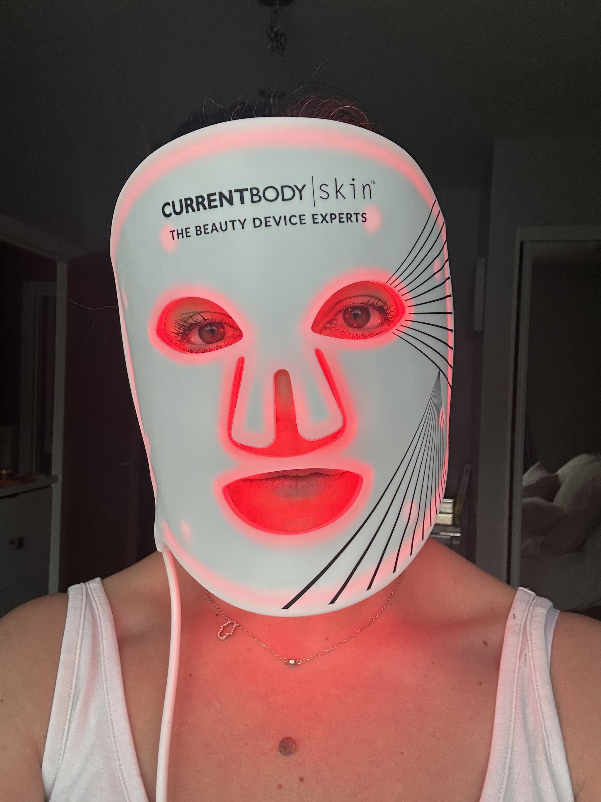 Woman wearing LED face Mask