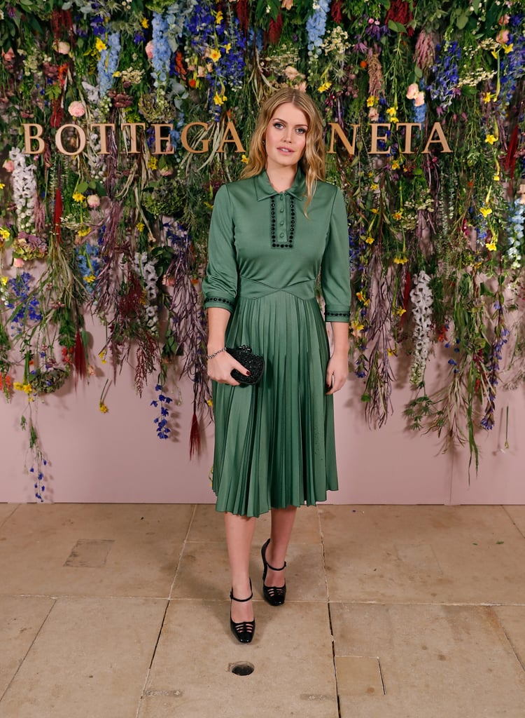 She wore a green pleated dress in November 2017.