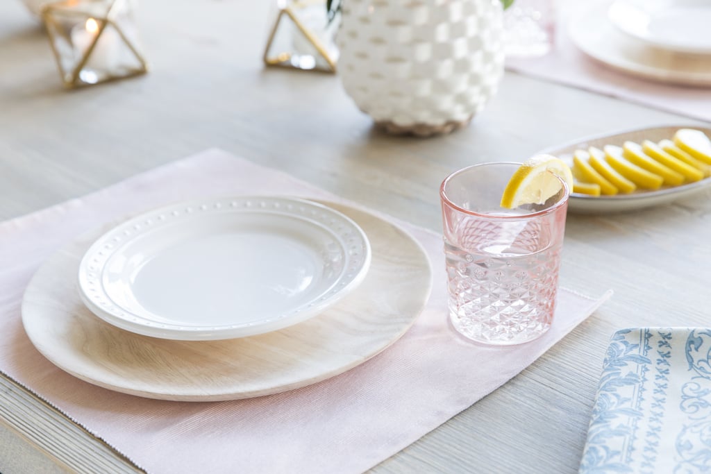 Soft pink accents lend a touch of glamour to the space while keeping it sophisticated.