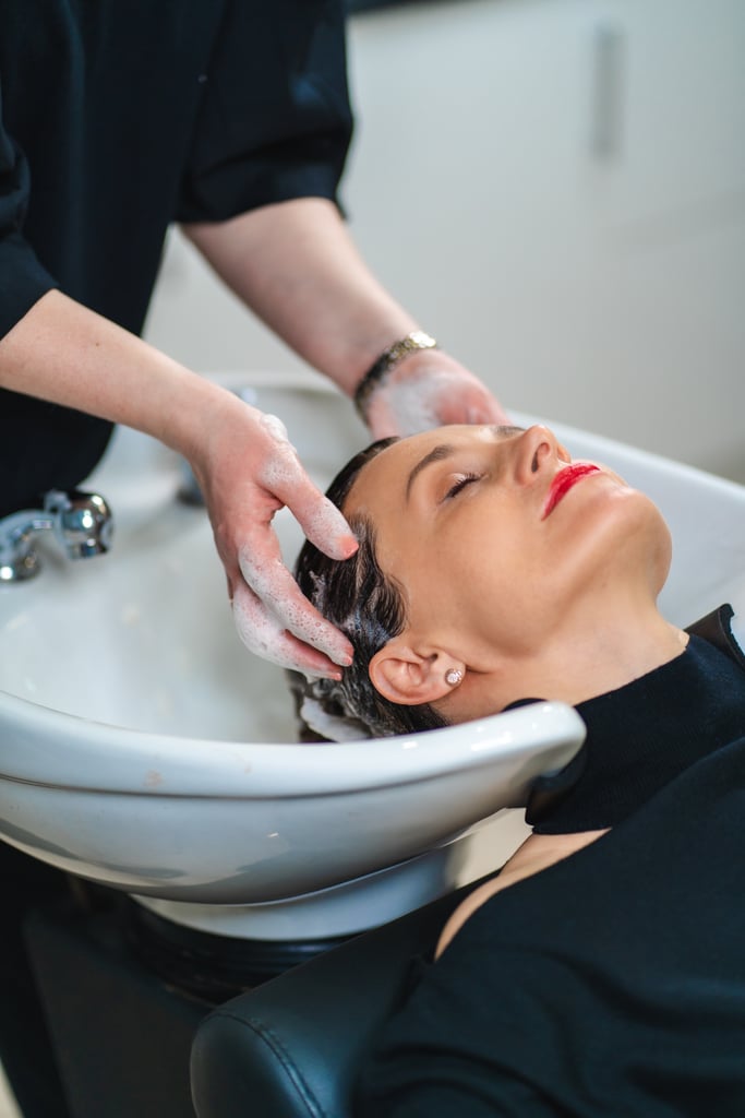 Anyone who frequently dyes their hair knows that washing it too much can dull your colour. That's why as a general rule, colourist Stephanie Brown says people with colour-treated hair shouldn't wash more than every other day. 
"If you have drier hair, try waiting a little longer," she says. "You want your hair to absorb some of your natural oils so it's strong and shiny. If you feel like you need to wash your hair more often, use a substitute, like a co-wash or cleansing conditioner like the Unwash Biocleansing Conditioner. These don't strip the oils out and add moisture to the hair."
TLDR; If you have colour-treated hair, don't wash your hair more than every other day. Try to go at least three to four days without shampooing if you can to preserve the colour. 

    Related:

            
            
                                    
                            

            When to Wash Your Hair After Colouring to Make Sure It Lasts