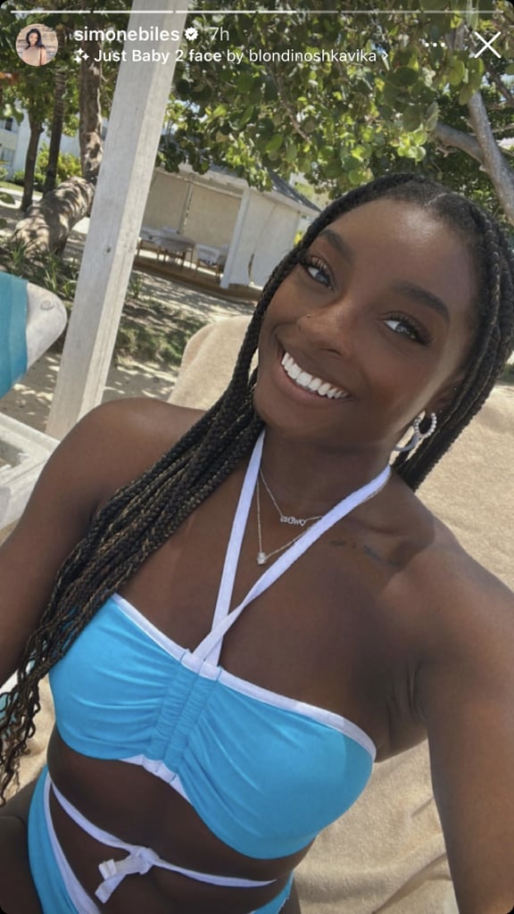 Simone Biles is currently on vacation in the Caribbean, serving up plenty of stellar poolside looks. Though the 25-year-old has spent the past few months posting an array of swimsuit snaps, this particular vacation has given the world tons of colorful beachside inspiration, from her printed cropped rash-guard bikini to her pink and orange swimsuit. Now, she's closing out the season in a brightly colored swimsuit, which she posted to Instagram Stories on Thursday. 
With this bikini, Biles is pulling out all the stops. First and foremost, in bright turquoise, this two-piece swimsuit allows the gymnast to jump headfirst into the neon trend that we've been seeing all season long. What's more, the bright white detailing not only ruches up her bandeau top and ties around her neck in halter form, but it also does the same on the bottom, crisscrossing up her waistline and knotting at the front, right above her navel. It is, as you surely know, one of those bikinis that is totally worth the weird tan lines. Biles opted for full coverage on the bottom this time, eschewing the popular thongkini trend, but right on time for the crisscross style making waves in the swimwear market and recently spotted on Chlöe's Instagram feed. 
Though Biles left her fiancé, NFL player Jonathan Owens, behind on this trip, he was still top of mind for her, as she wished him luck in his last preseason game on Instagram on Thursday night. Recently, she's been sharing several sartorial tributes to her beau, including a crop top emblazoned with his Texans team logo and a tank top with his number, 36. The two even matched in coordinating white looks for a recent date night at a Chris Brown concert. Biles is currently in the throes of planning her wedding and recently revealed a gold and white color palette as well as an embellished Prada bag she plans to wear to bridal events, a gift from Owens, of course. 
While we wait for the stellar bridal looks that will surely come, feel free to turn to Biles to inspire your swimsuit shopping. If you're looking for one last pre-Labor Day surfside outfit idea, check out Biles's bright turquoise bikini ahead.

    Related:

            
            
                                    
                            

            Simone Biles Vacations in a Bright Cutout Thongkini