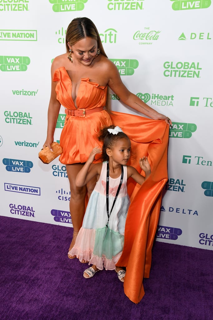 See Chrissy Teigen's Orange Dress at Global Citizen Vax Live