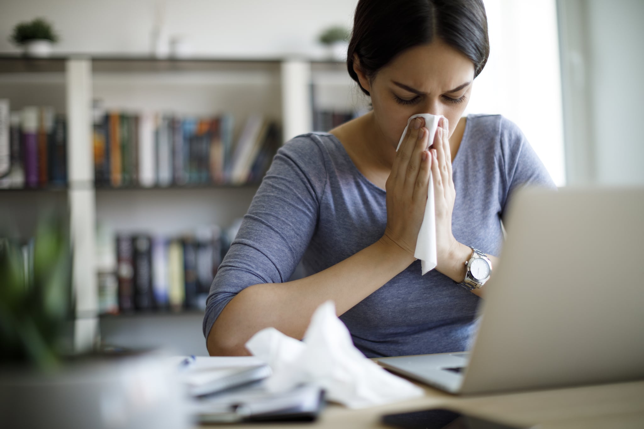 Ill woman working from home office