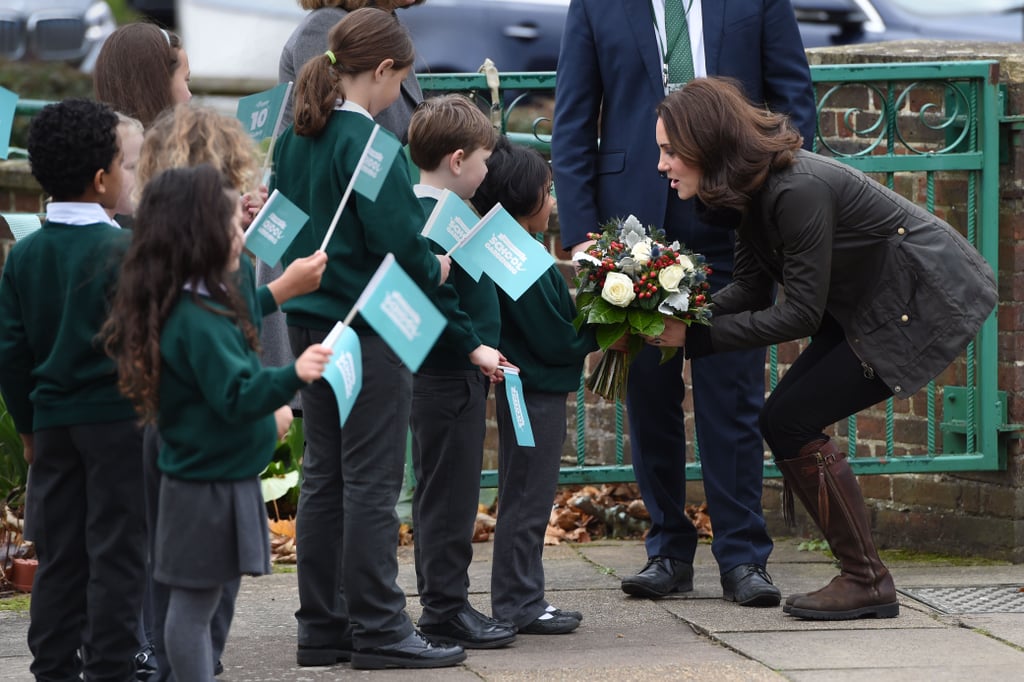 Ah, flat boots. She'll crouch through that line of kids with ease.