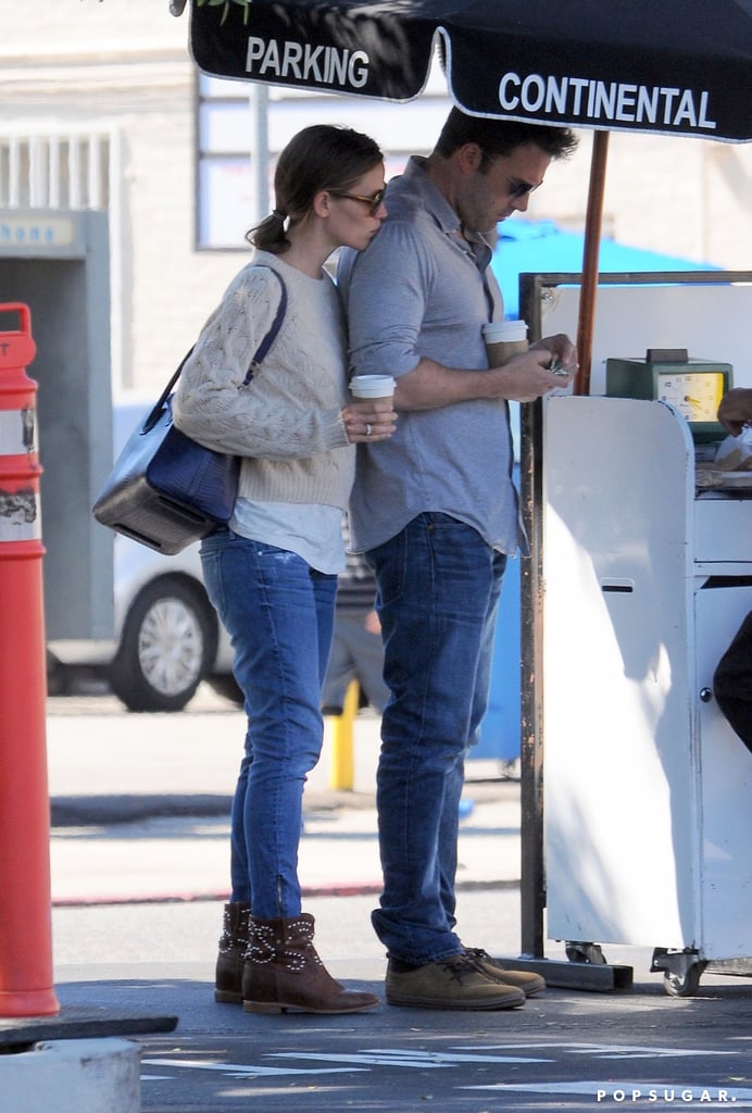 Jennifer planted a sweet smooch on Ben's shoulder as they waited at valet after lunch in LA in August 2013.