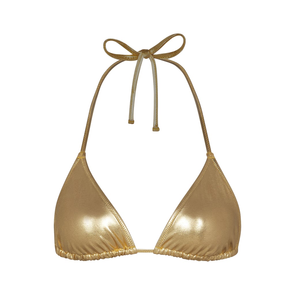 Skims Metallic Swim Triangle Top in Gold ($48)